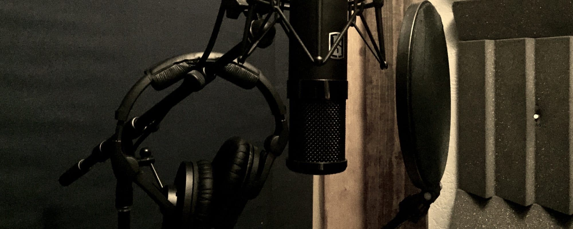 Microphone and headphones set up in the vocal booth